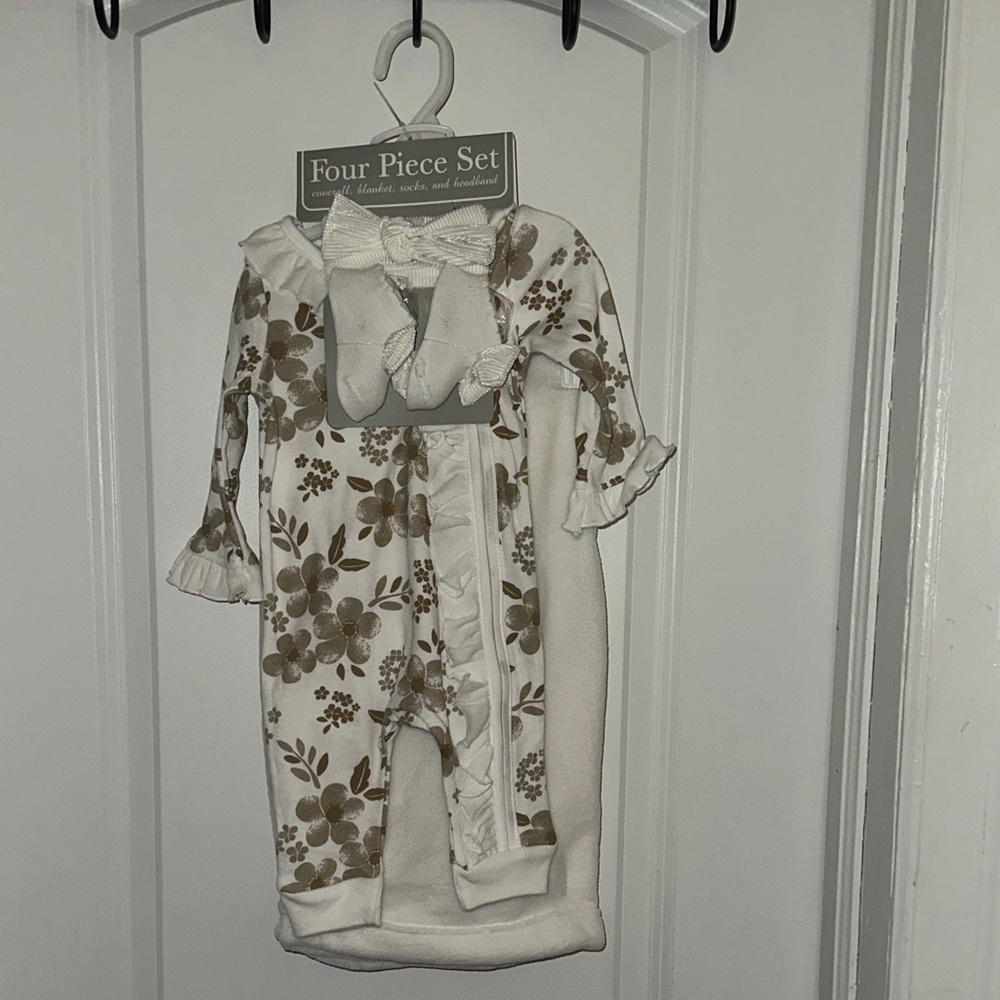 Four piece set coverall, blanket, socks, and headband